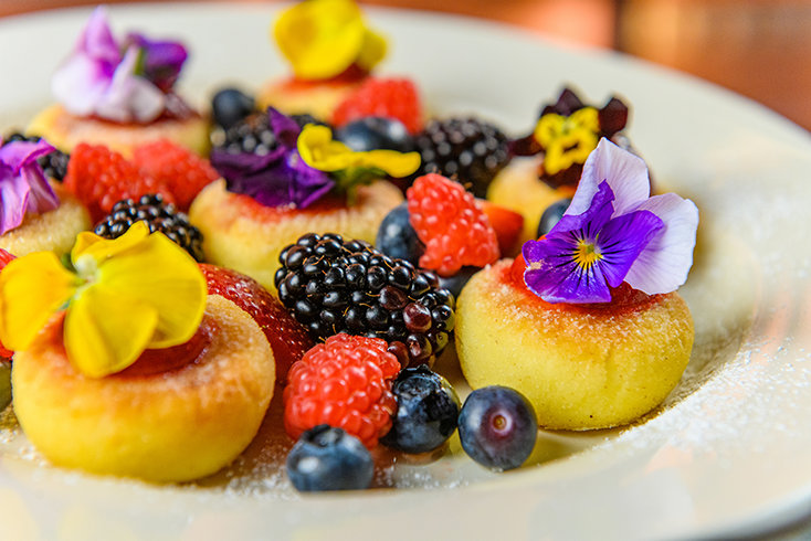 Syrnyky, tender cottage cheese pancakes served with berries, bring another traditional Ukrainian specialty to Nubo’s Cleveland Street menu.
