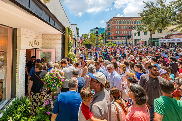 Visitors line up outside Nubo following the ribbon-cutting as the newly opened café welcomes guests inside its renovated location on Cleveland Street.
