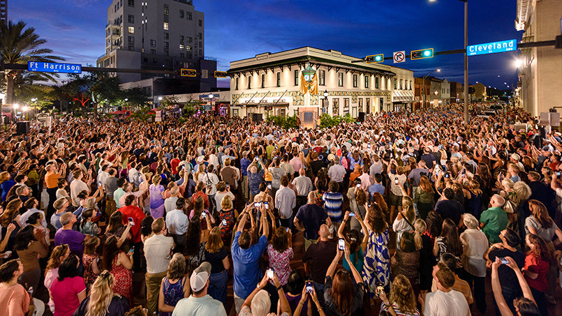 Thousands pack one of downtown Clearwater’s most recognizable crossroads as the restored Peoples Bank Building once again becomes the center of activity during the unveiling of its historic clock.