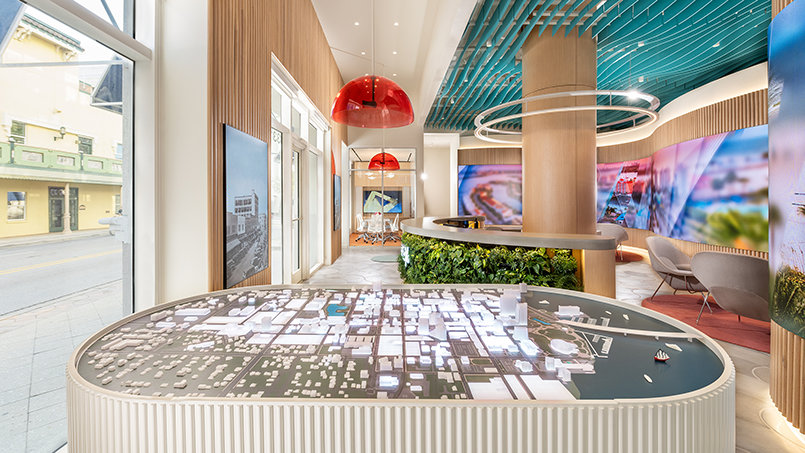 A detailed 3-D diorama illuminates the district’s building-by-building transformation, offering a clear view of development now underway.