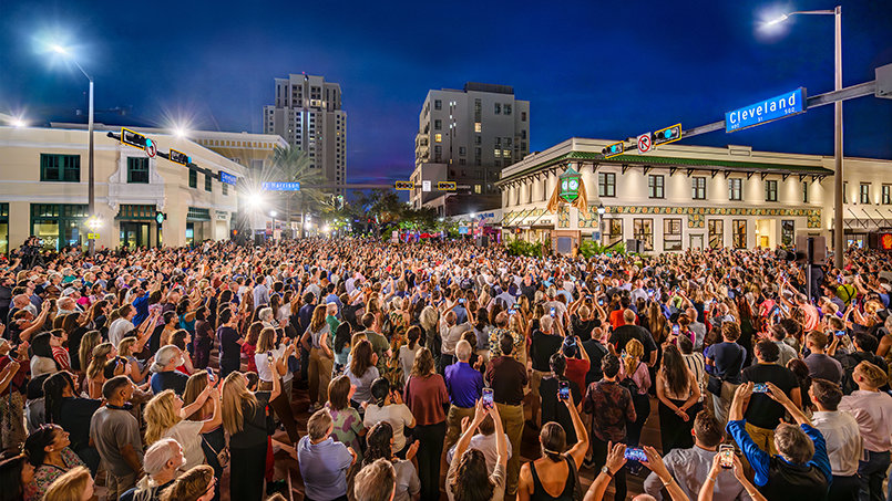 The return of the Peoples Bank clock draws a packed crowd to the corner of Cleveland Street and Fort Harrison Avenue, bringing new life to a landmark that helped shape downtown Clearwater for generations.